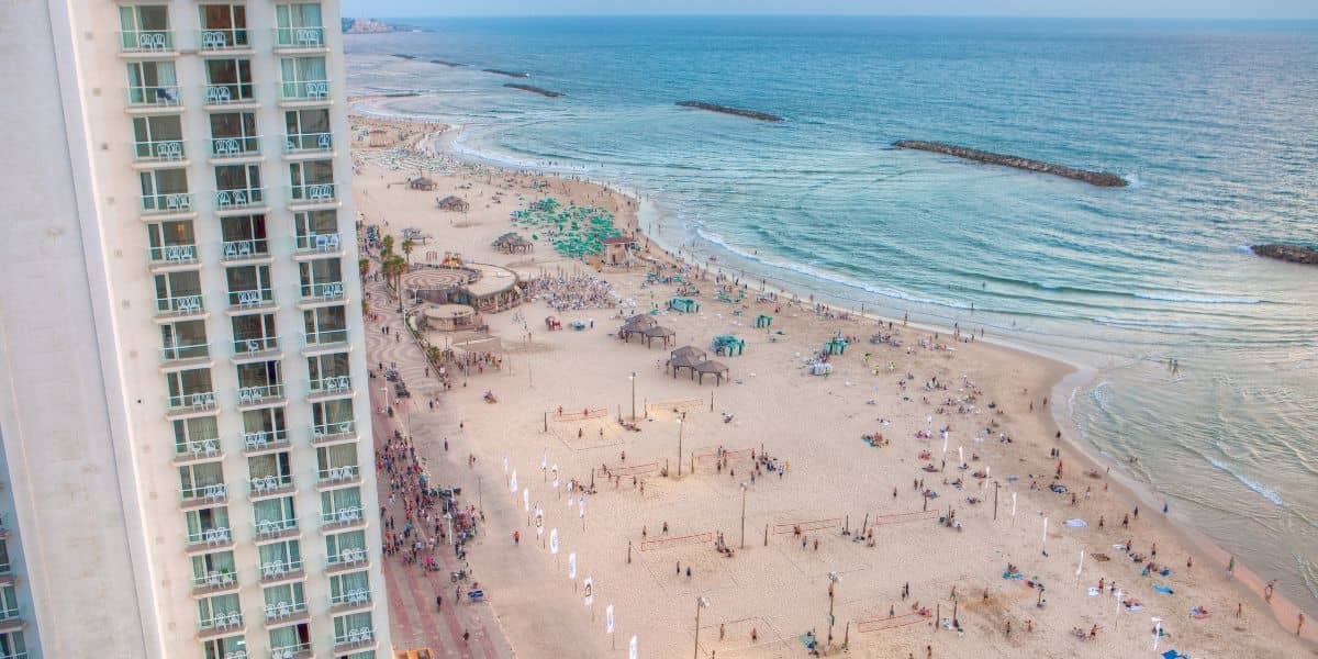 Get a tan in Israel in the summertime