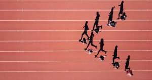 Runners line up at a starting line during a track and field race